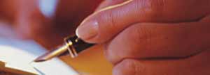 Person signing a letter