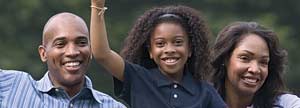 Girl and her parents raising their hands
