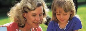 Mom and daughter playing in the backyard