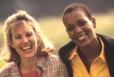 Two mothers having a good time in a park