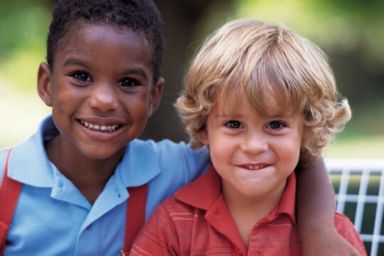 Kids holding each other
