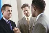 Businessmen having a chat standing up