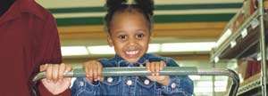 Little girl smiling and looking at camera