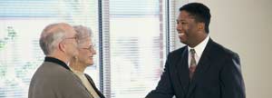 Banking officer shaking hands with a customer