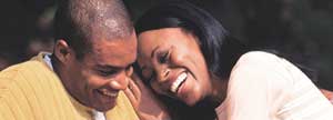 Woman leaning on her husband's shoulder