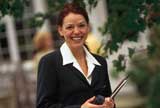 Real estate agent in front of a house