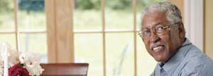 Elderly man relaxing at his cottage
