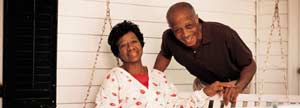 Elderly couple conversing in their porch