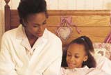 Woman reading a book to her kid