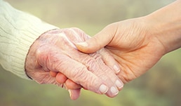Mother and daughter holding hands
