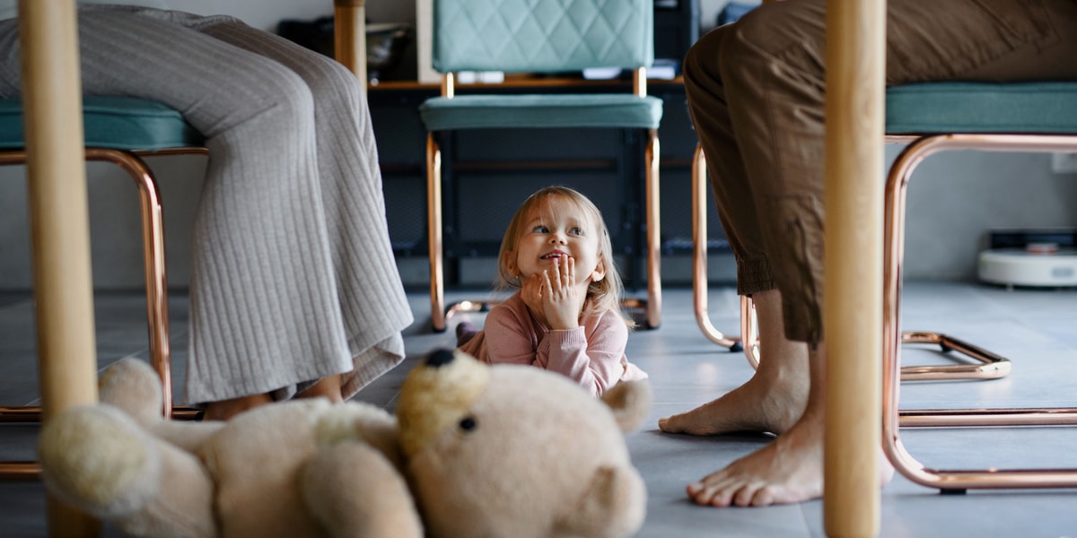 Child on floor smiling