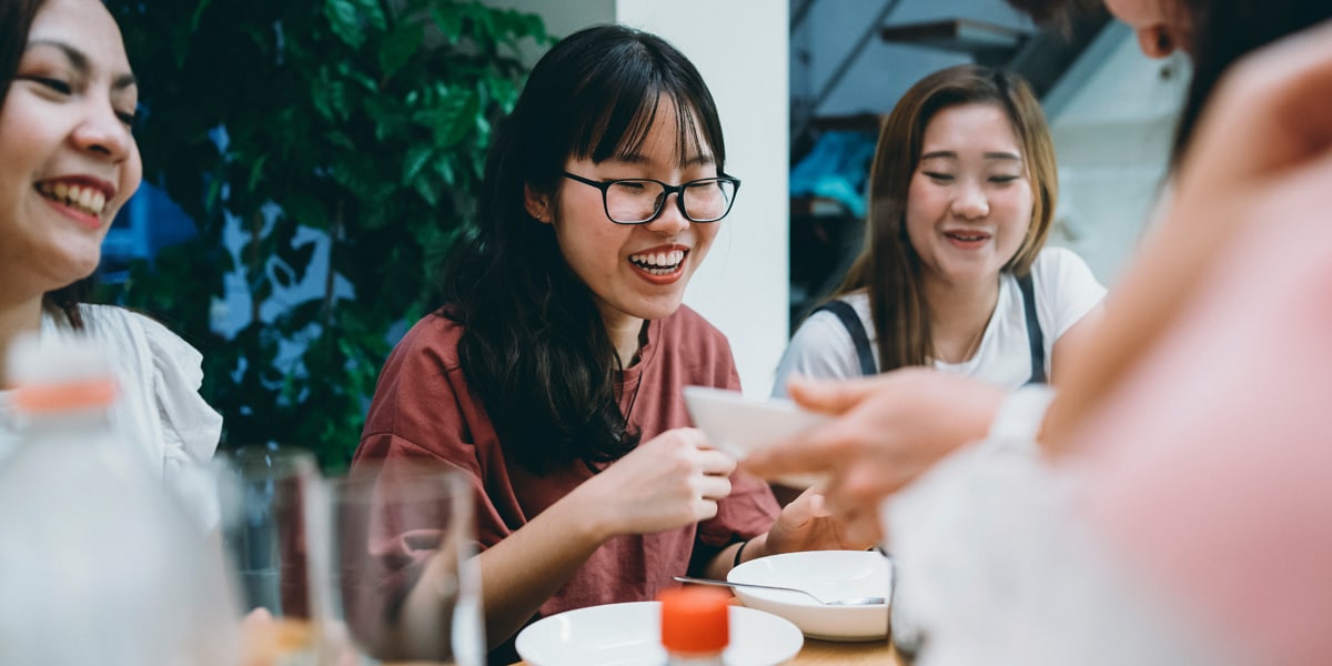 friends sharing dinner at a restaurant