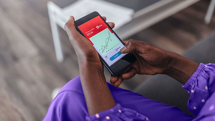 Image of a person holding a mobile phone