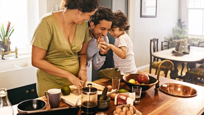 parents and child in a kitchen