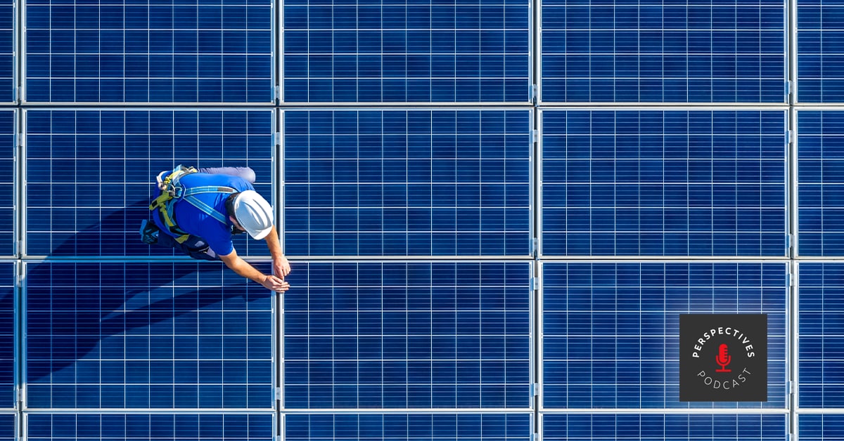 Man installing solar panel, seen from above