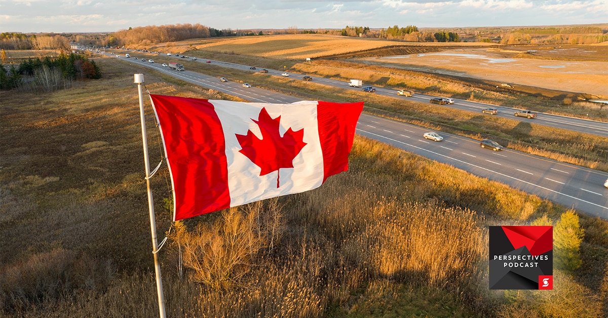 Canadian flag with highways in background