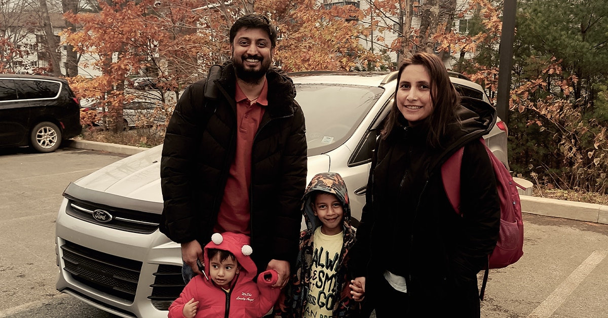 Family outside smiling