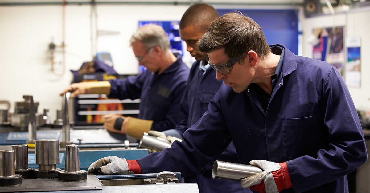 Workers assembling items in factory