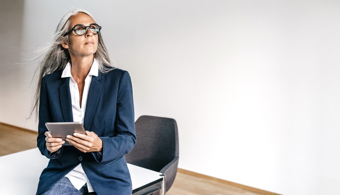 A confident woman in a business suit.