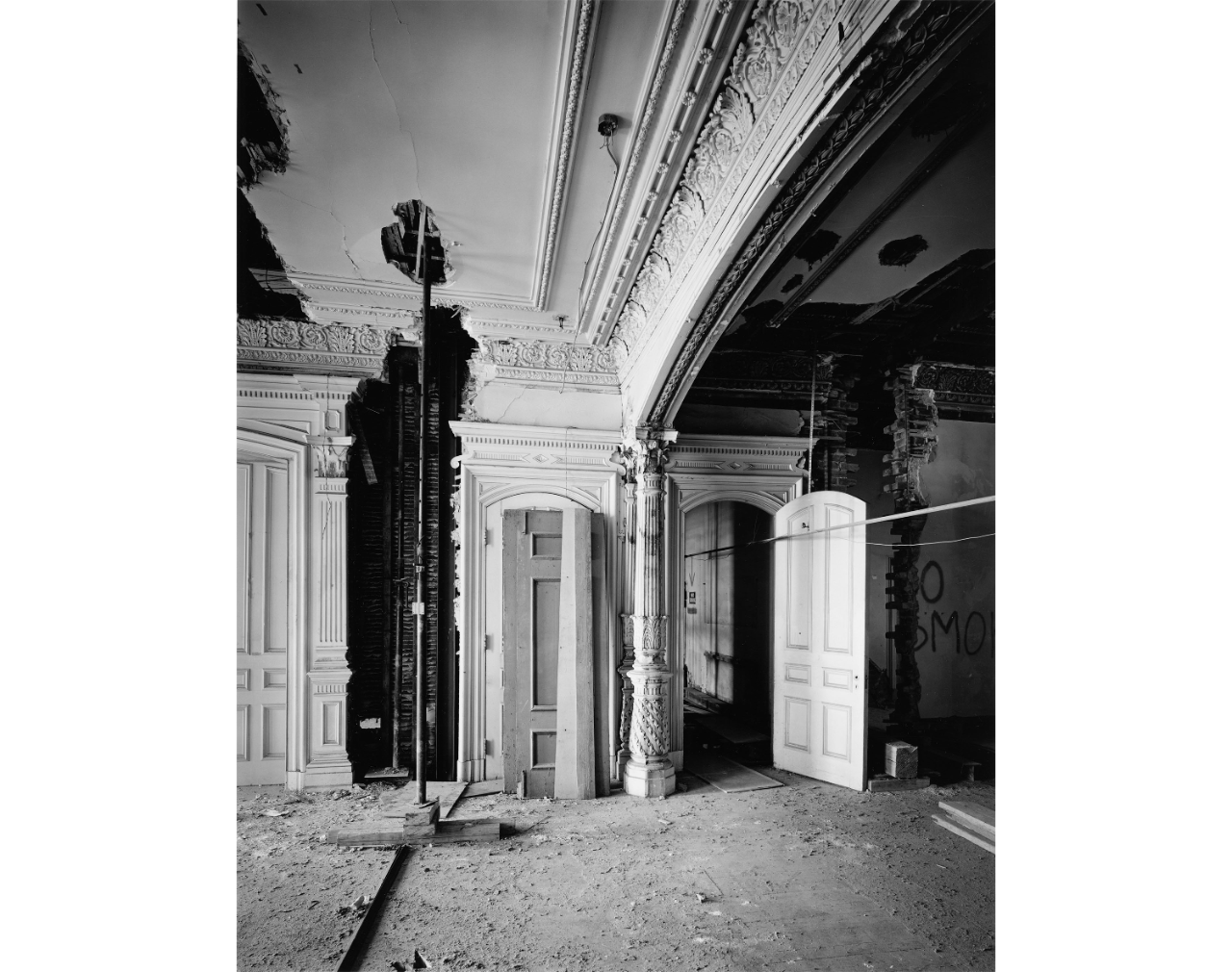 Interior room with ornate features and signs of disrepair