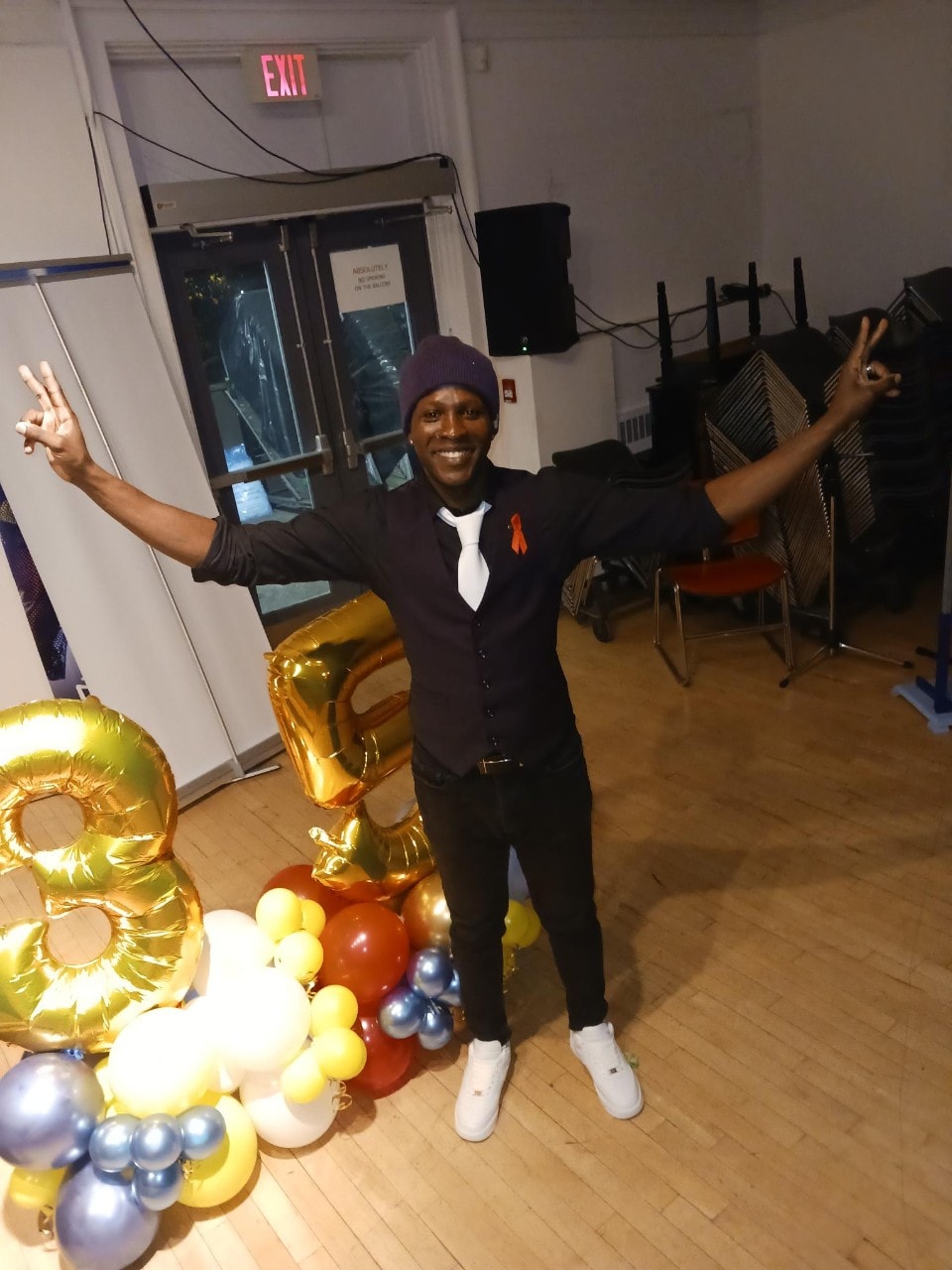 James Frederick with hands in the air