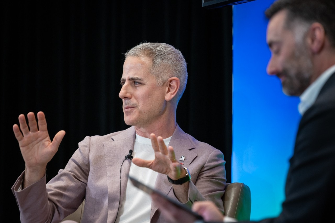 Caleb Goodman on stage at Pride event