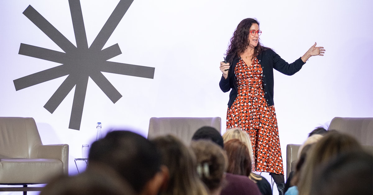 Sara Lomelin on stage speaking to crowd