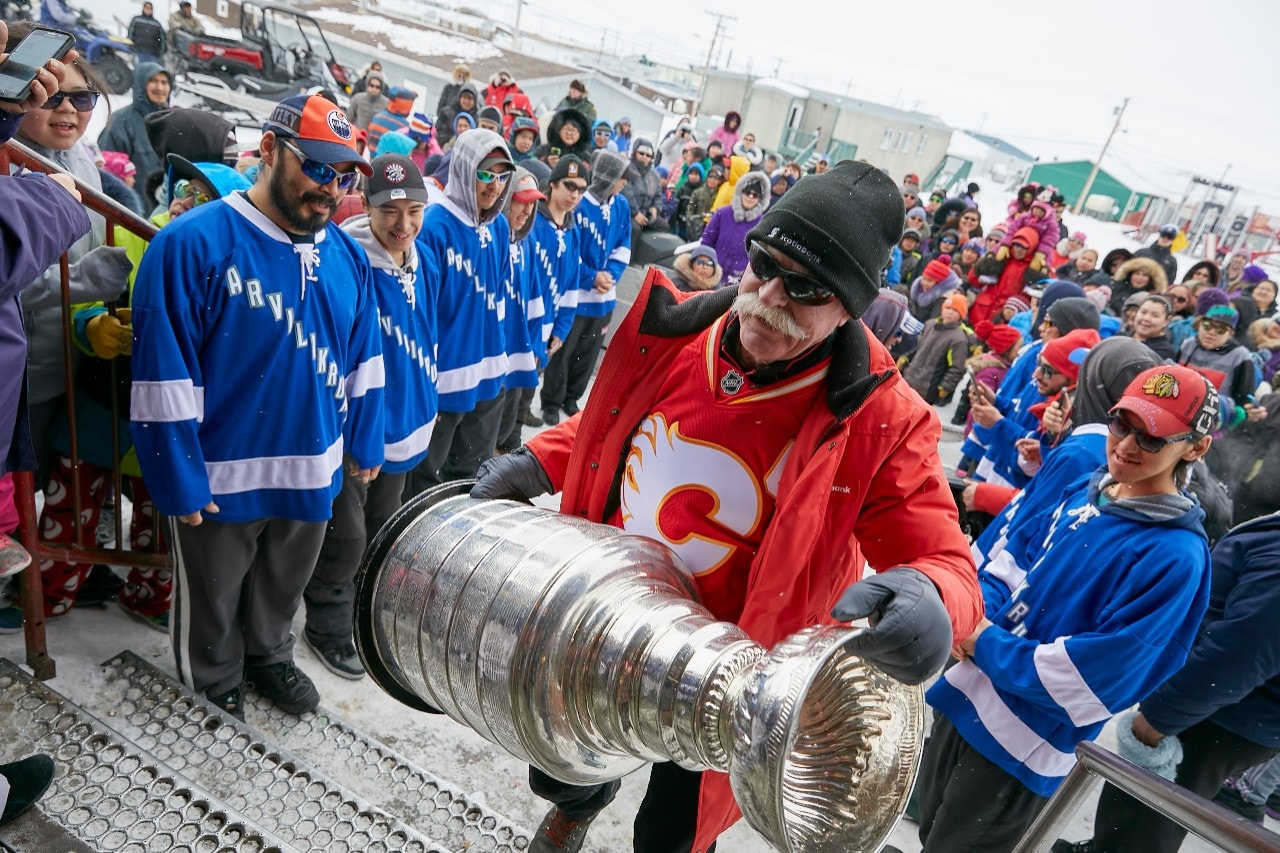 It’s not the first time Lanny McDonald has hoisted the Stanley Cup®, but for many in Kugaaruk, a moment they will likely never forget. Image courtesy of MIV Photography.